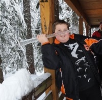 Boy holding large icicle
